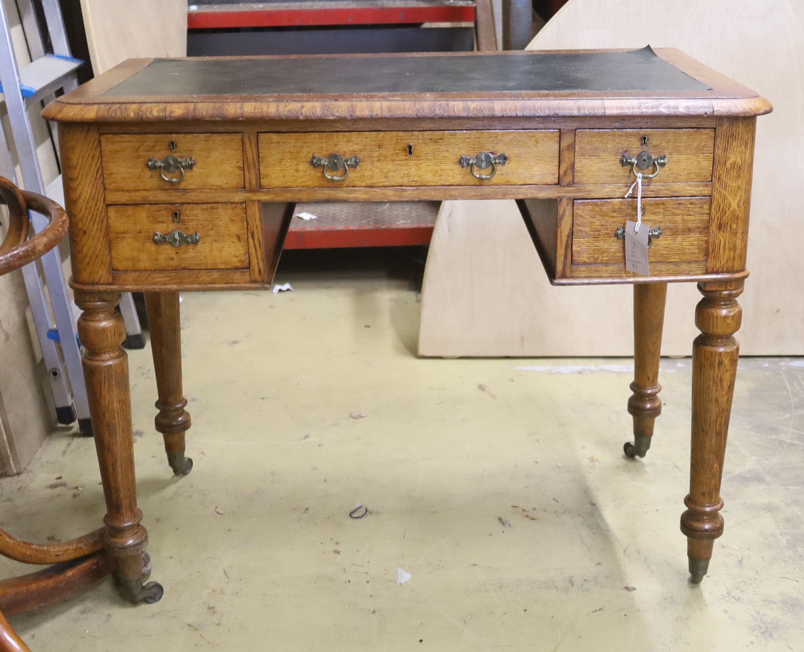 A Victorian oak kneehole writing desk, length 94cm, depth 51cm, height 75cm